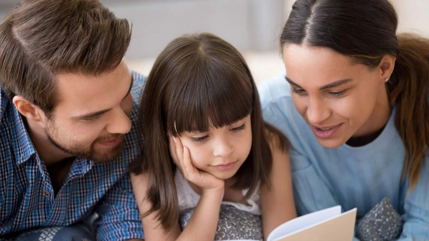 Happy family reading - Is Commercial Electricity Cheaper Than Residential