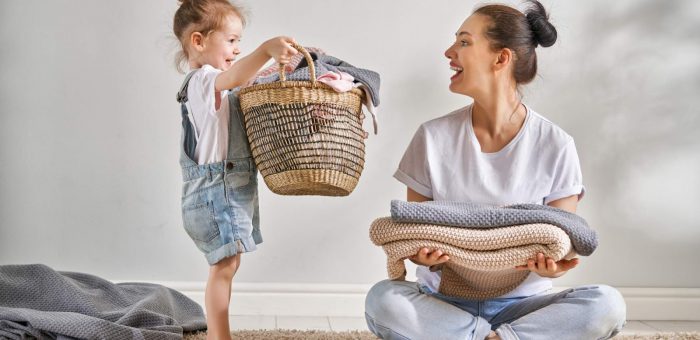 Woman doing laundry - 10 Ways To Save Electricity At Home