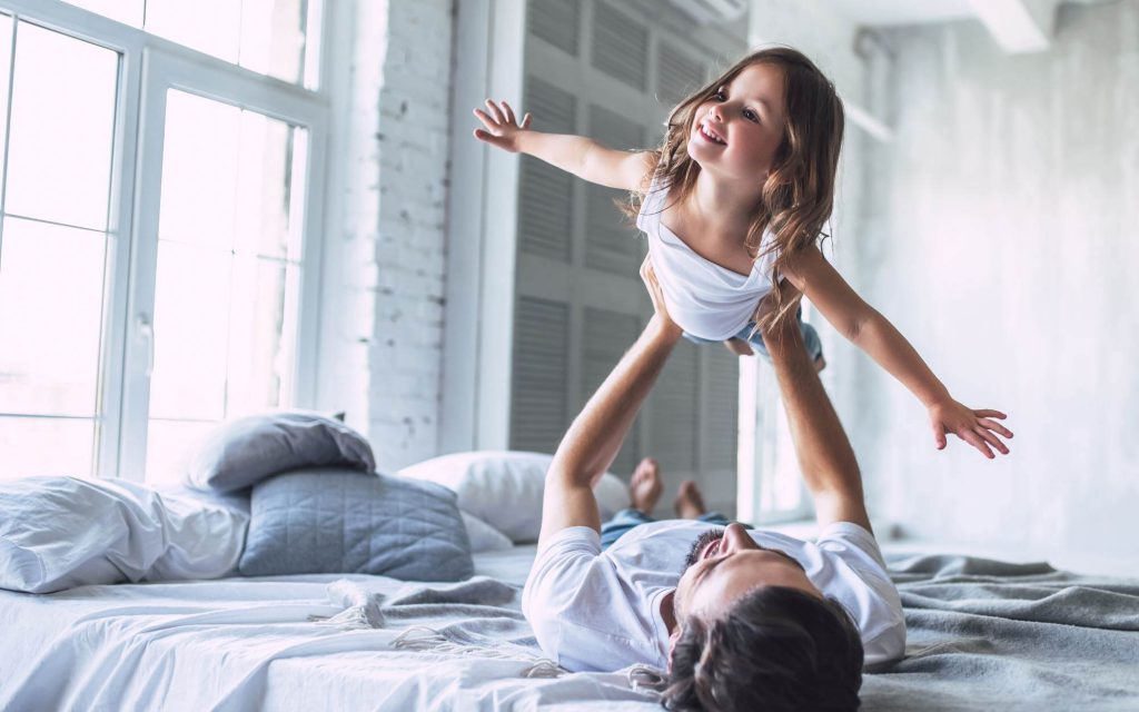 Father and daughter playing. Power Wizard can help find great rates on Amigo Energy.
