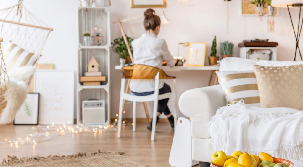 Woman working from home. Average-electric-bill-for-2-bedroom-apartment-in-Texas.
