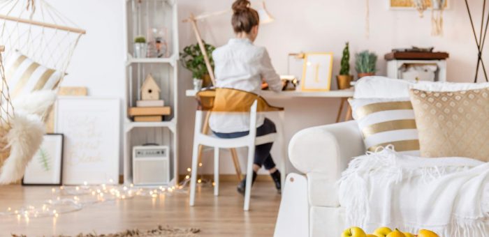 Woman working from home. Average-electric-bill-for-2-bedroom-apartment-in-Texas.