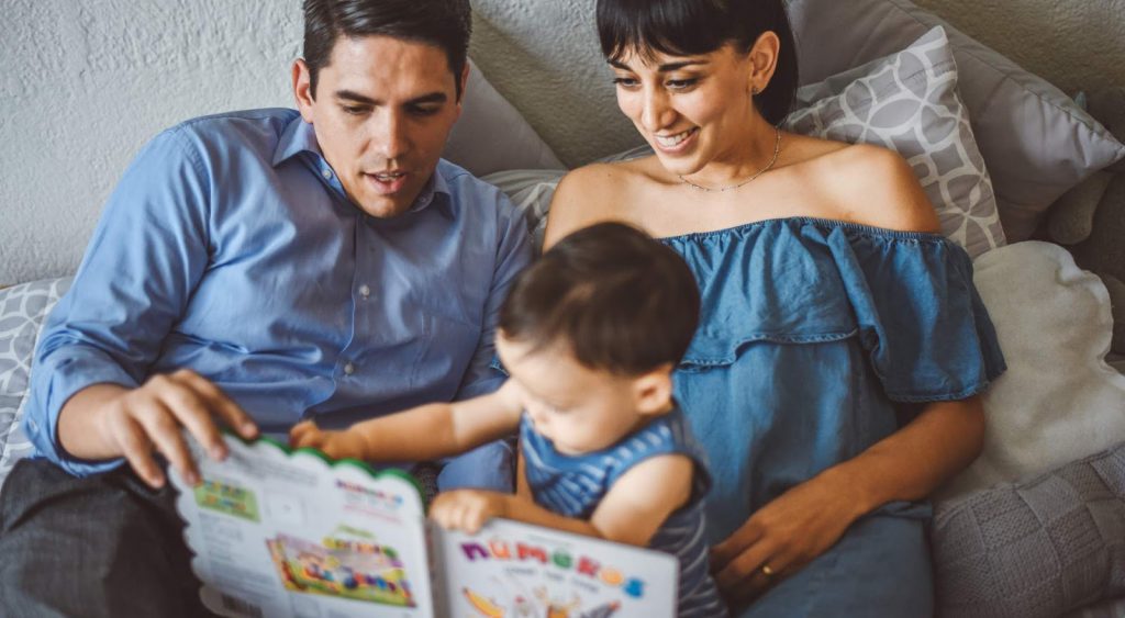 Happy family on bed. Average-electric-bill-for-2-bedroom-apartment-in-Texas.