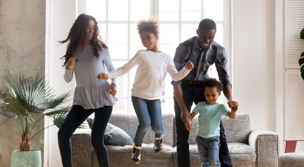 Family playing in house. Constellation NewEnergy
