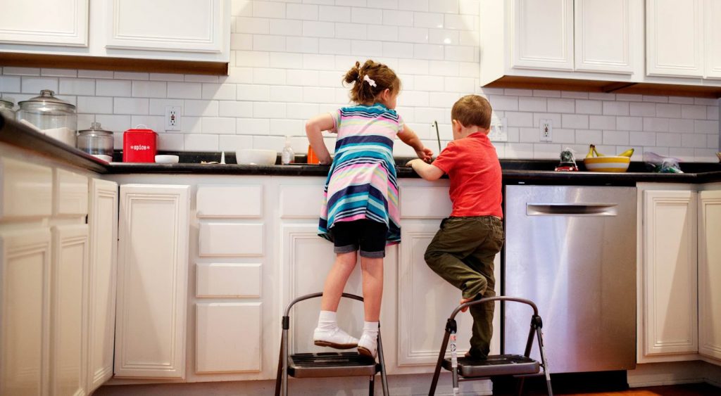 Kids playing in kitchen in Corpus Christi
