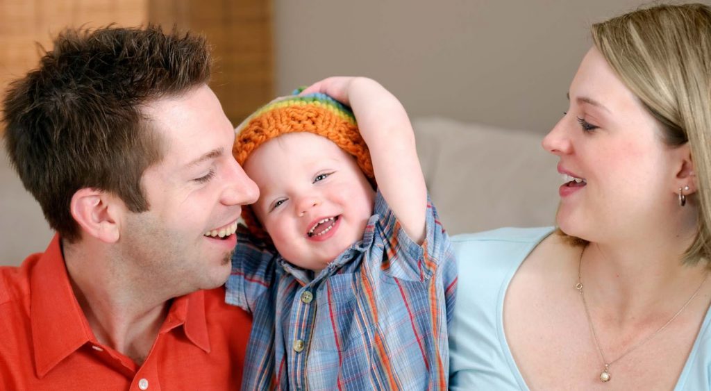 Happy couple with child. Cost Per Kwh By Source
