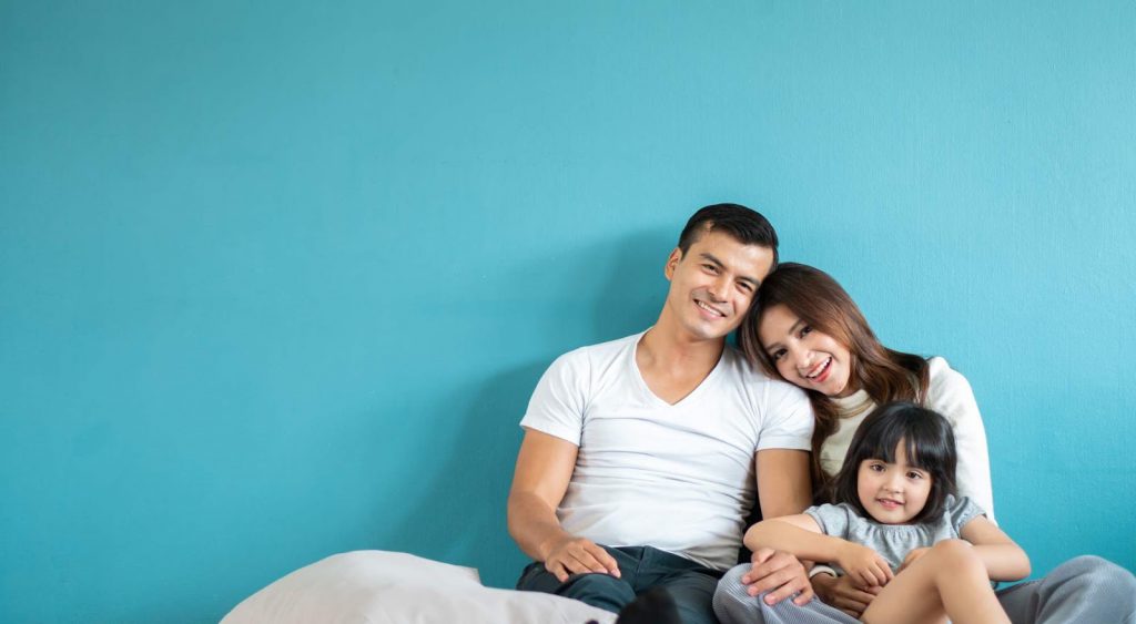 Happy family, blue wall. Dallas Electricity