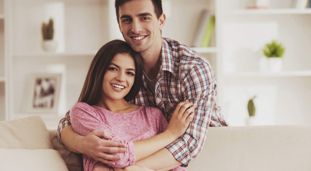 Happy couple in house - Electric Companies In Longview Texas