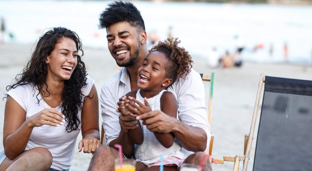Happy family at beach - Electric Rates By Zip Code