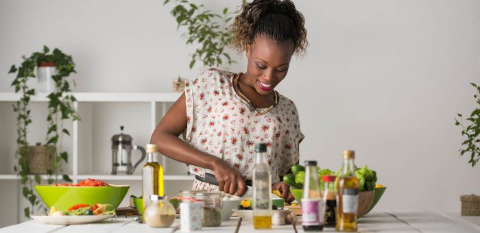 Woman cooking - Electricity Bills