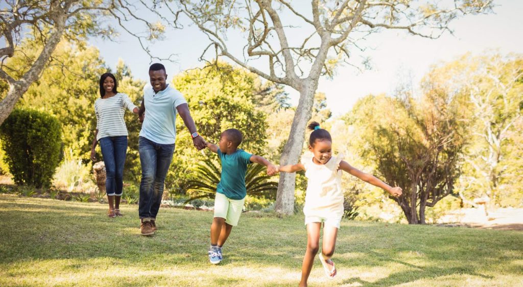 Family playing outside. Electricity Companies Corpus Christi