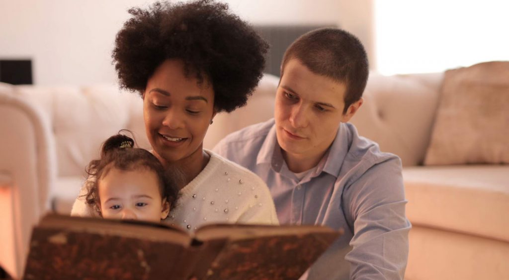 Happy family reading book - Electricity Companies In Odessa