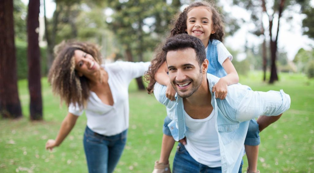 Happy family outside - Electricity Companies In Odessa