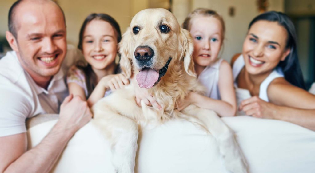 Happy family with dog - Electricity Companies Laredo Texas