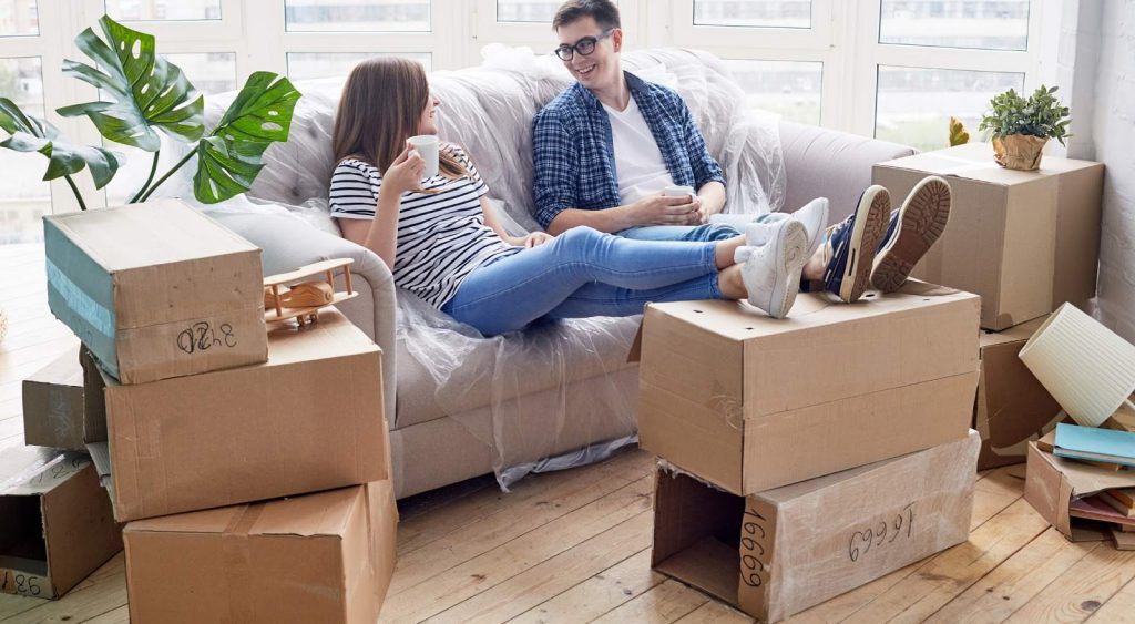 Happy family, newly moved in - Electricity For Apartments