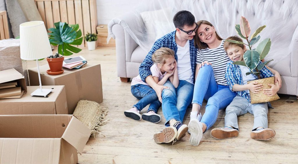 Happy family and boxes - Electricity For Apartments