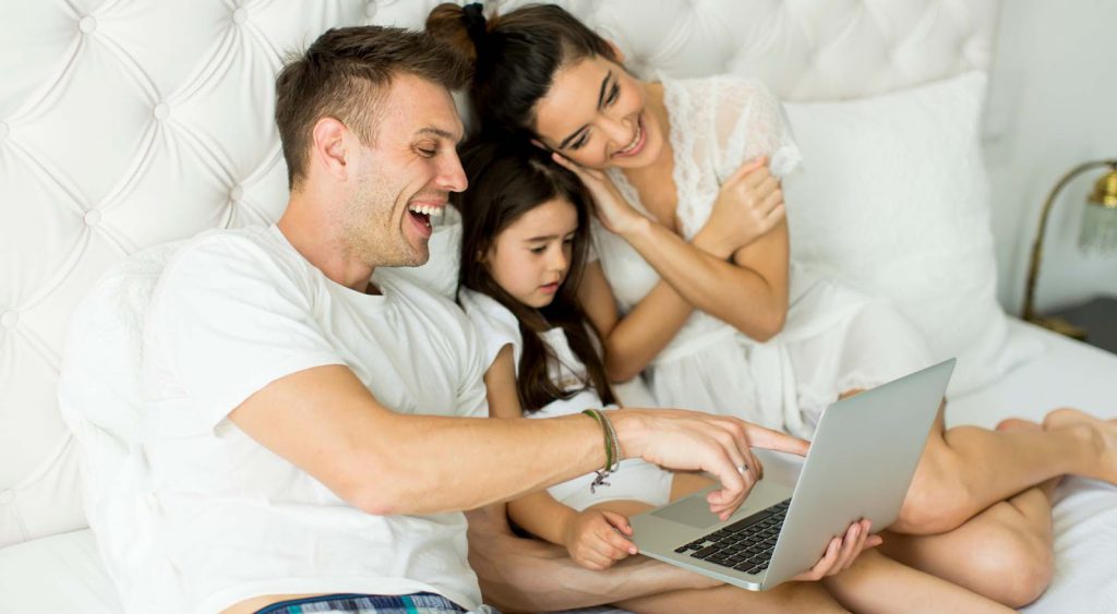 Happy family in bed - Electricity Killeen Texas