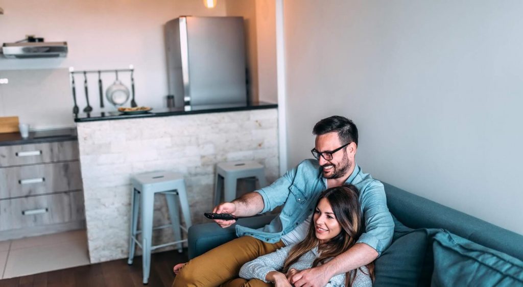 Happy family watching TV - Electricity No Deposit No Prepaid
