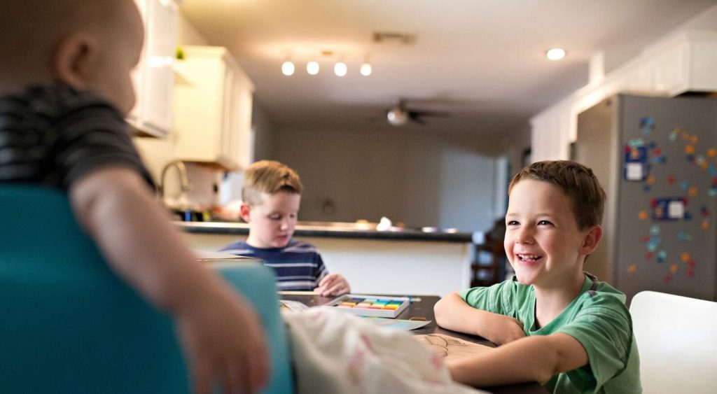 Happy family in kitchen - Electricity No Deposit No Prepaid