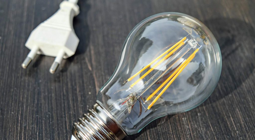 Lightbulb on table - Electricity Plans
