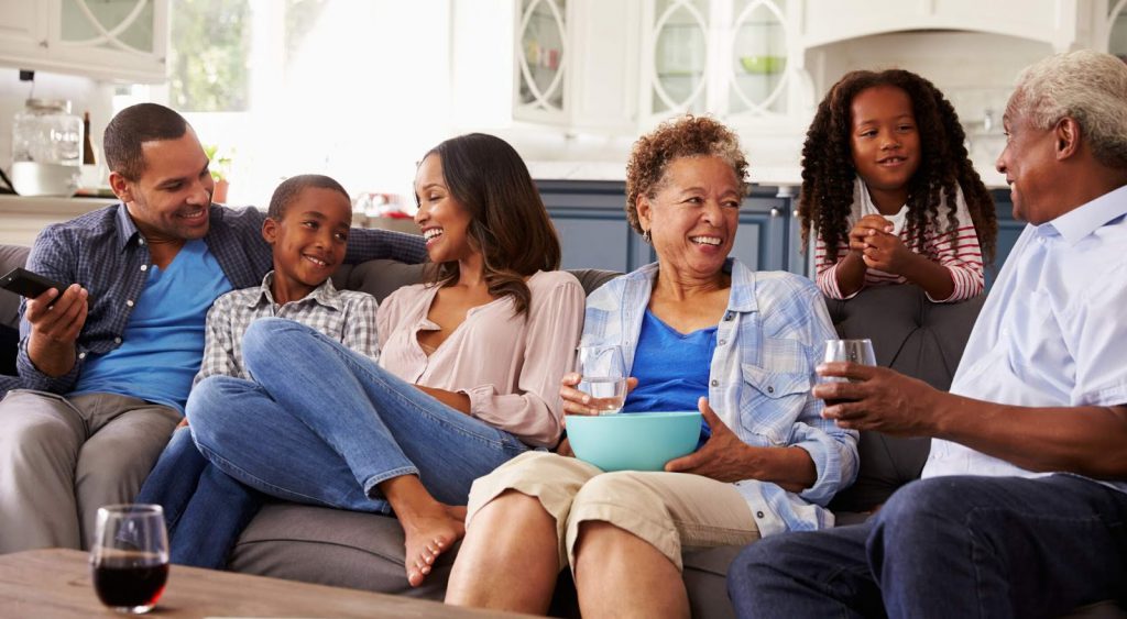Happy family on couch. Electricity Rates Corpus Christi