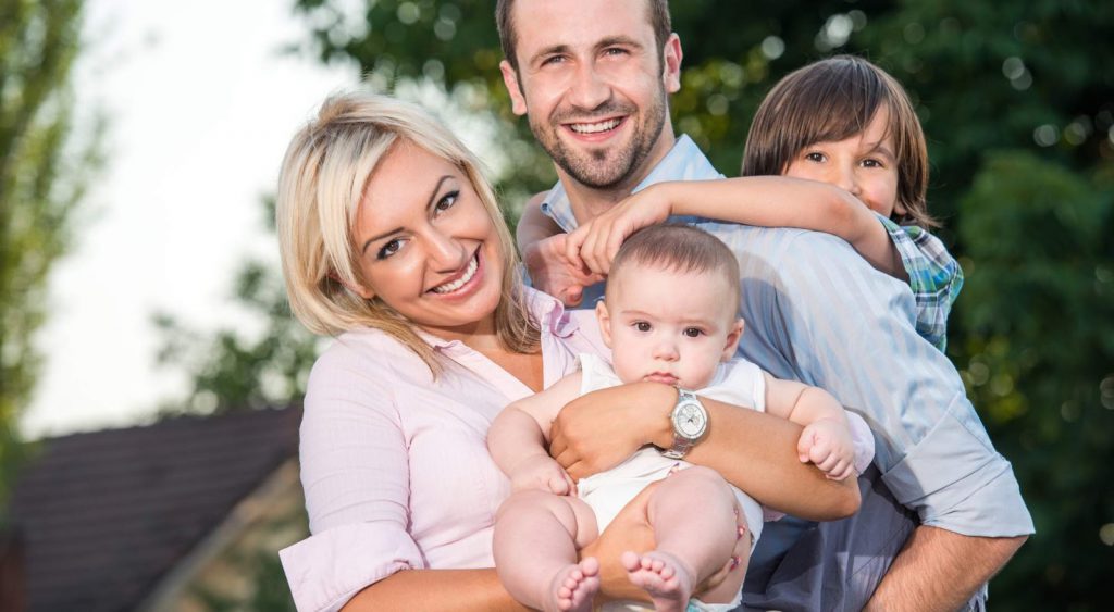 Happy family outside - Electricity Rates Killeen