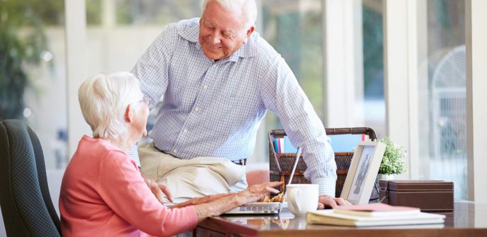 Senior couple shopping online - Electricity Senior Discount