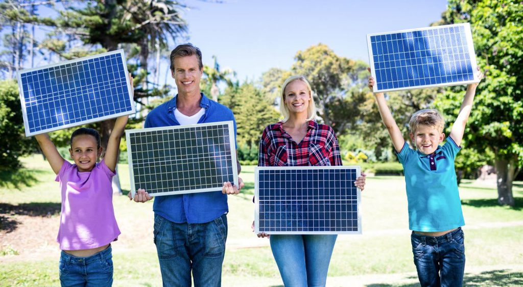 Happy family with solar panels - Energy In Texas