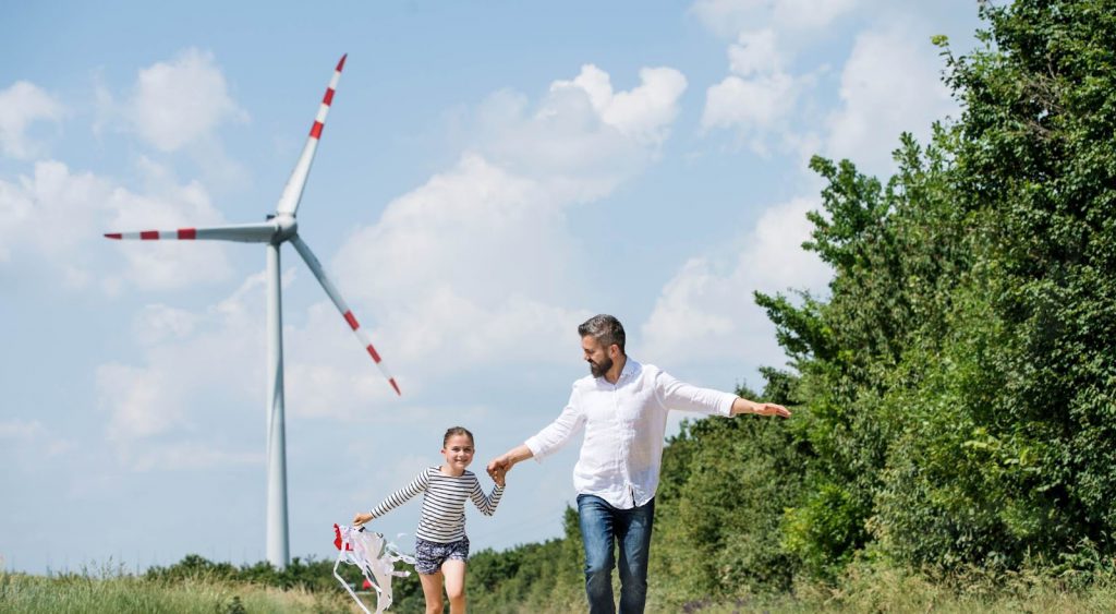 Father, daughter, windmill - Energy In Texas