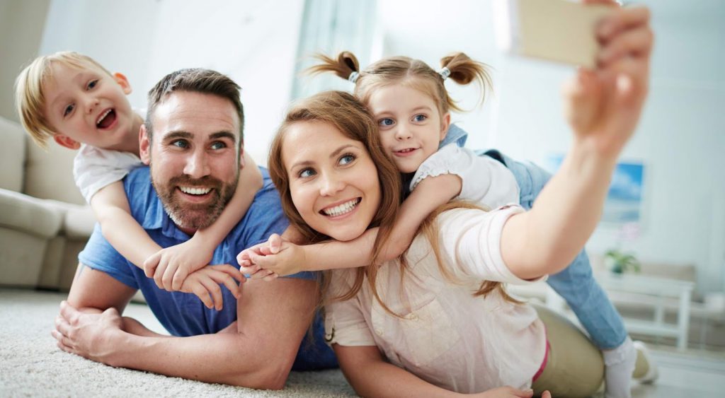 Happy family playing. Evolve Energy