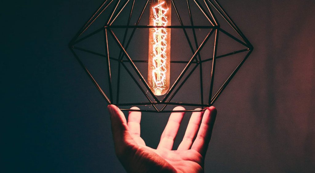 Man holding lantern - How To Get Electricity