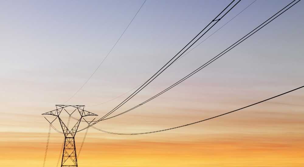 Powerlines at dusk - How To Save On Heating Costs In Apartment