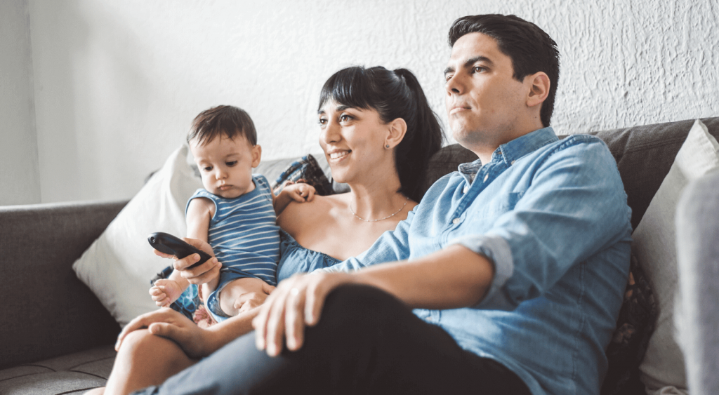 Family watching TV - How To Switch Electricity Providers