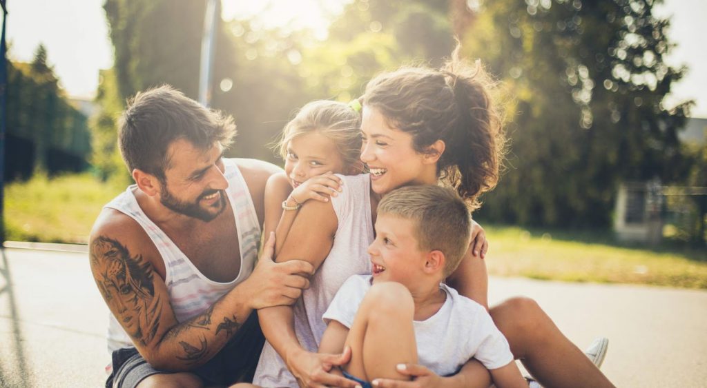 Happy family outside. IGS Energy