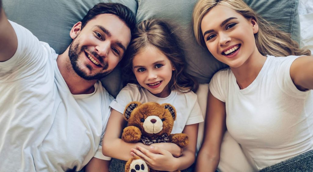 Happy family on bed - Liberty Power