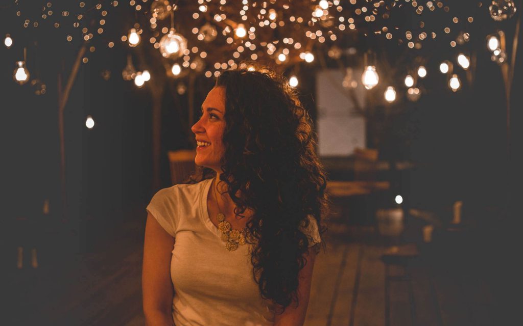 Woman with hanging lights - Light Companies