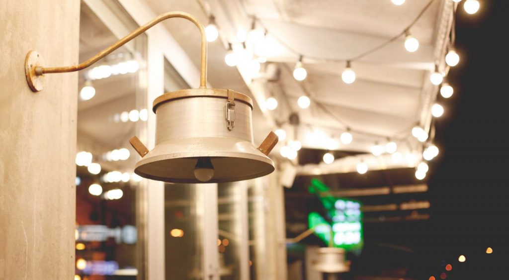 Hanging bell beneath lights - Longview