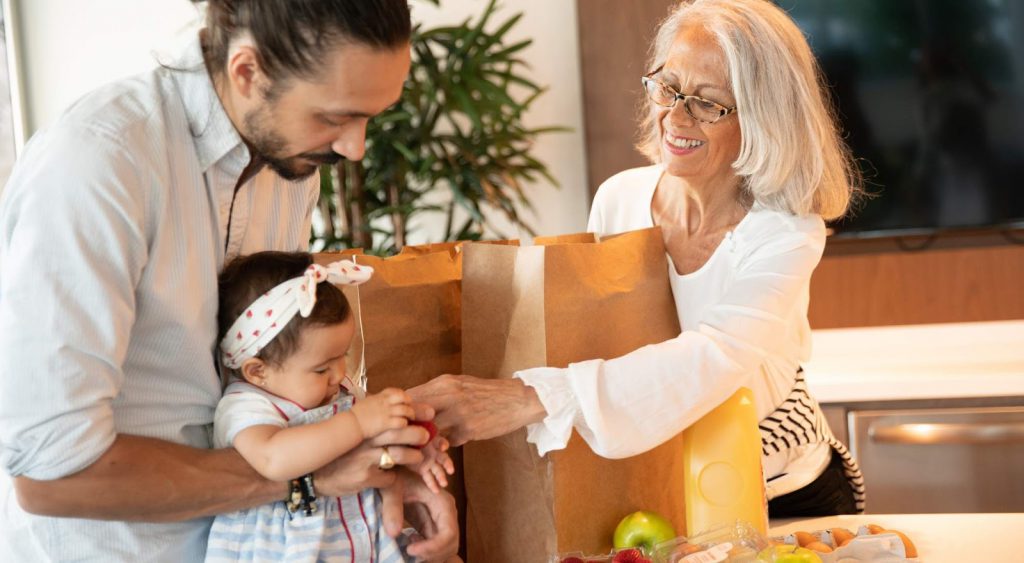 Happy family with groceries - No Deposit Electric Companies In Texas
