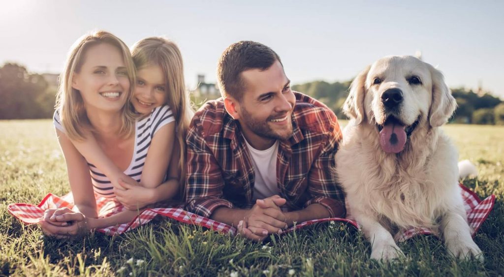 Family outside with dog - Nueces Electric