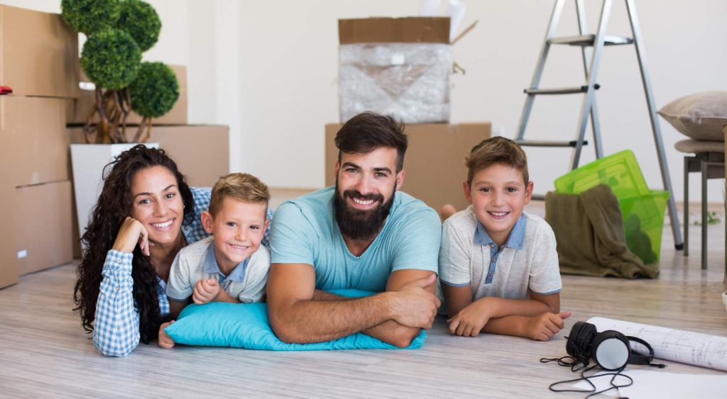 Happy family with boxes - Payless Power