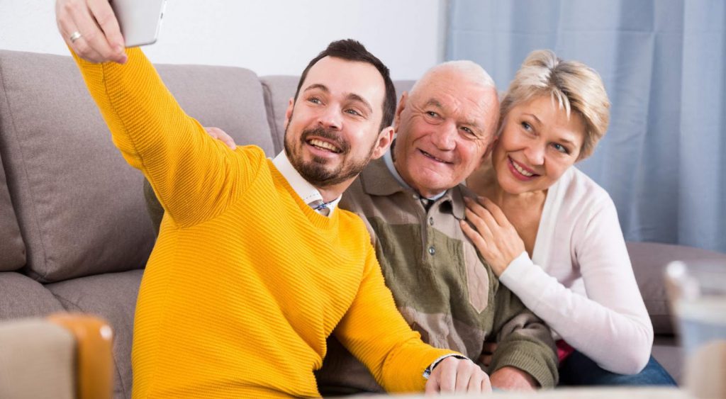Happy family on couch - Power of Texas