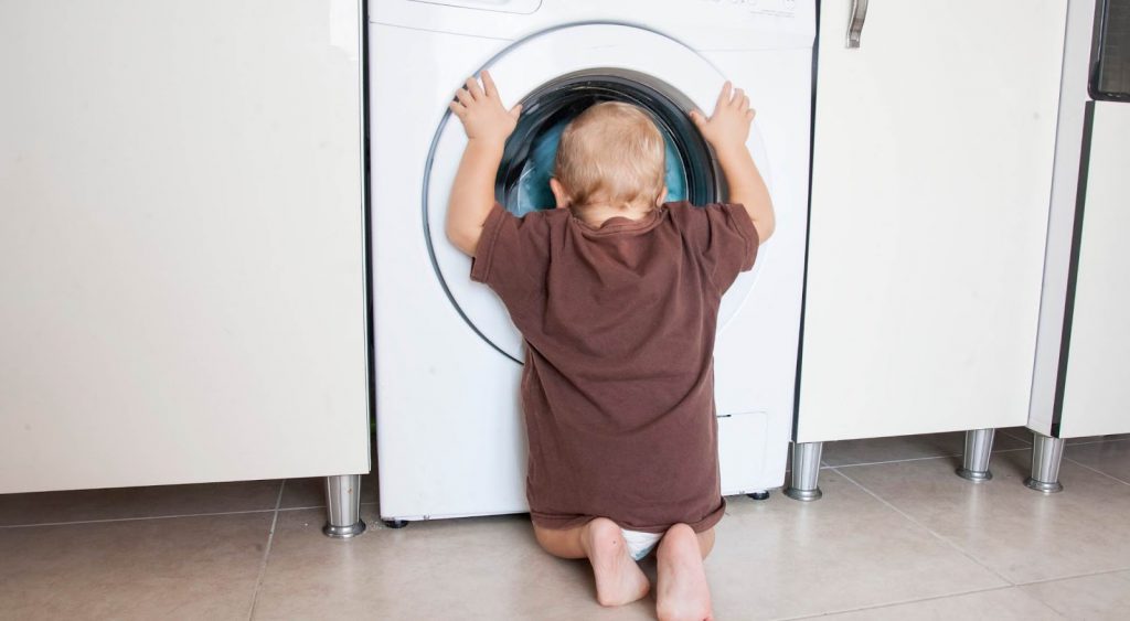Baby watching washing machine - Reliant Energy