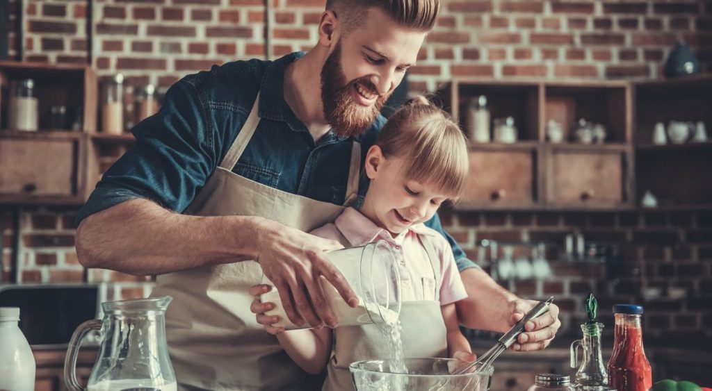 Father and son baking together - Reliant Energy