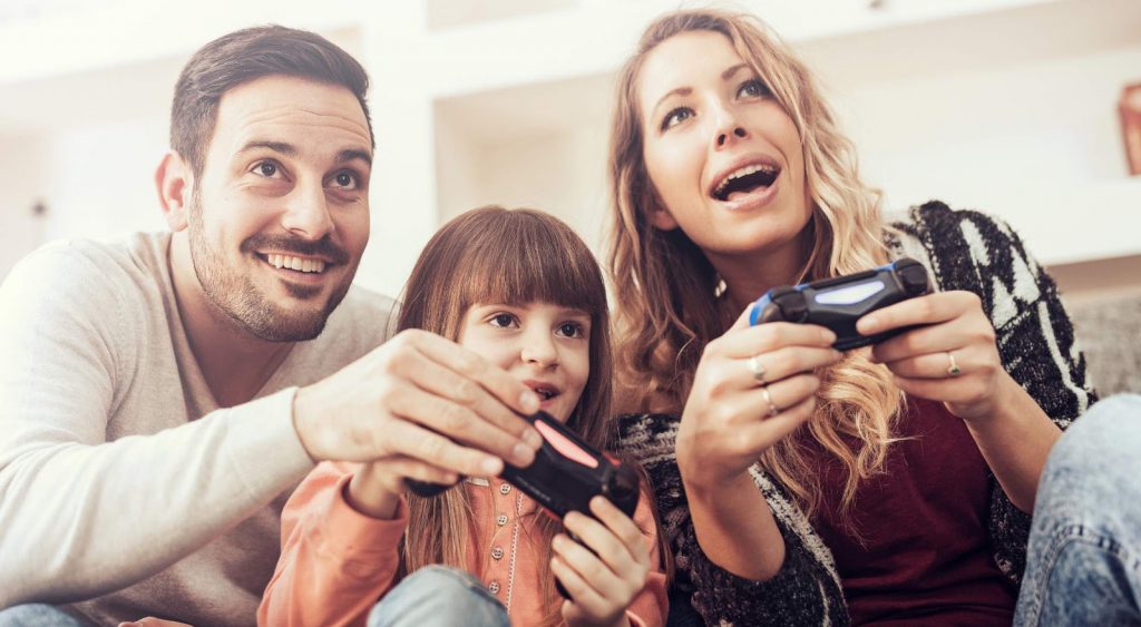 Family playing video games - Reliant Energy Truly Free Nights 12 Plan