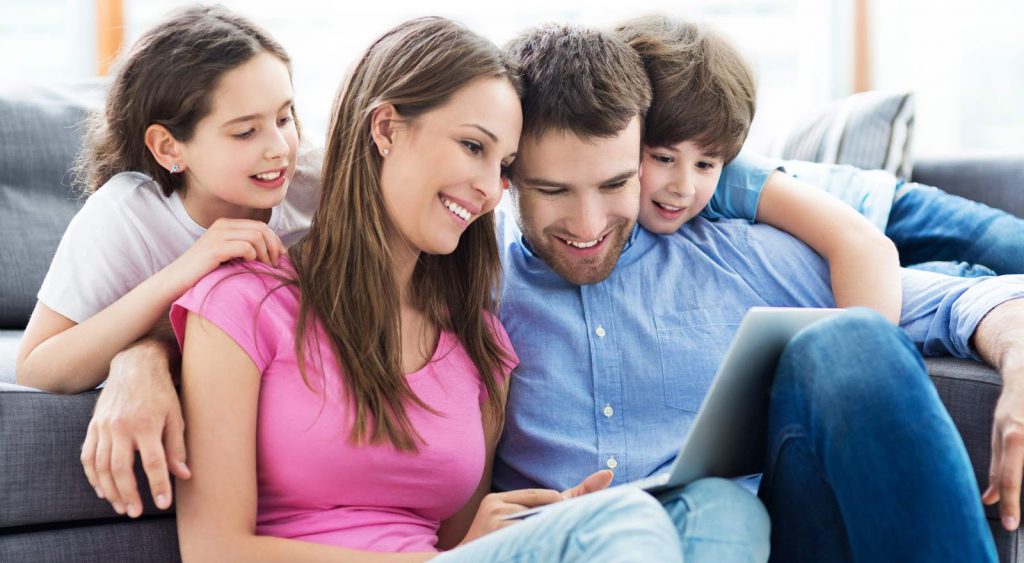 Happy family on couch - Secure 24