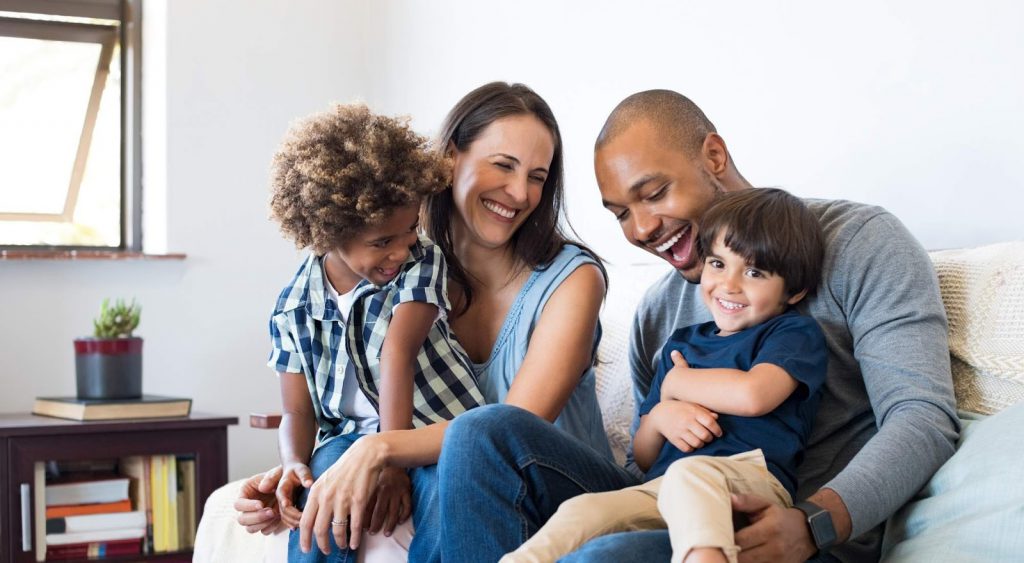 Happy family in home - Stream Energy
