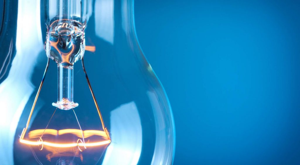 Lightbulb in front of blue - Think Energy