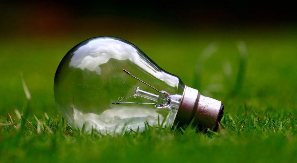 Lightbulb on glass - Xoom Energy