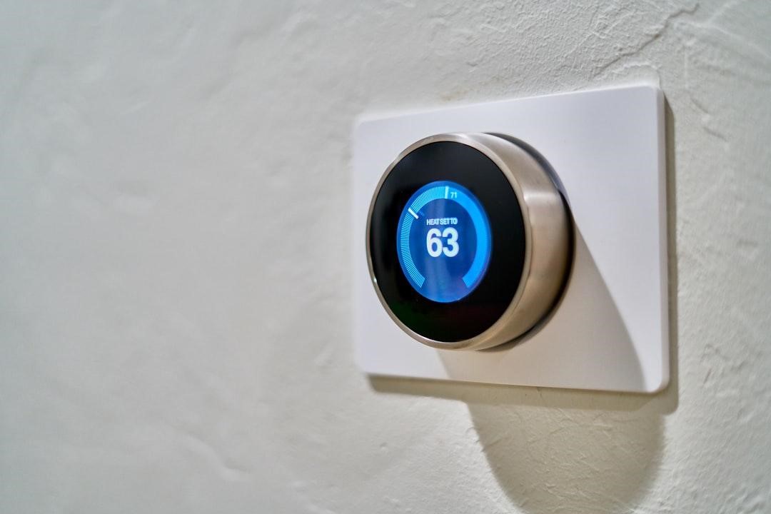 A smart thermostat set at 63 degrees
