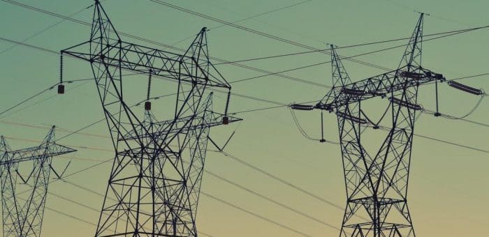 blue sky with electrical towers and wires