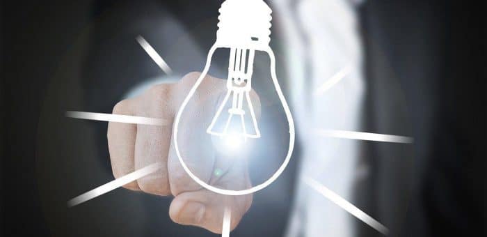 a drawn light bulb with a hand pointing at it